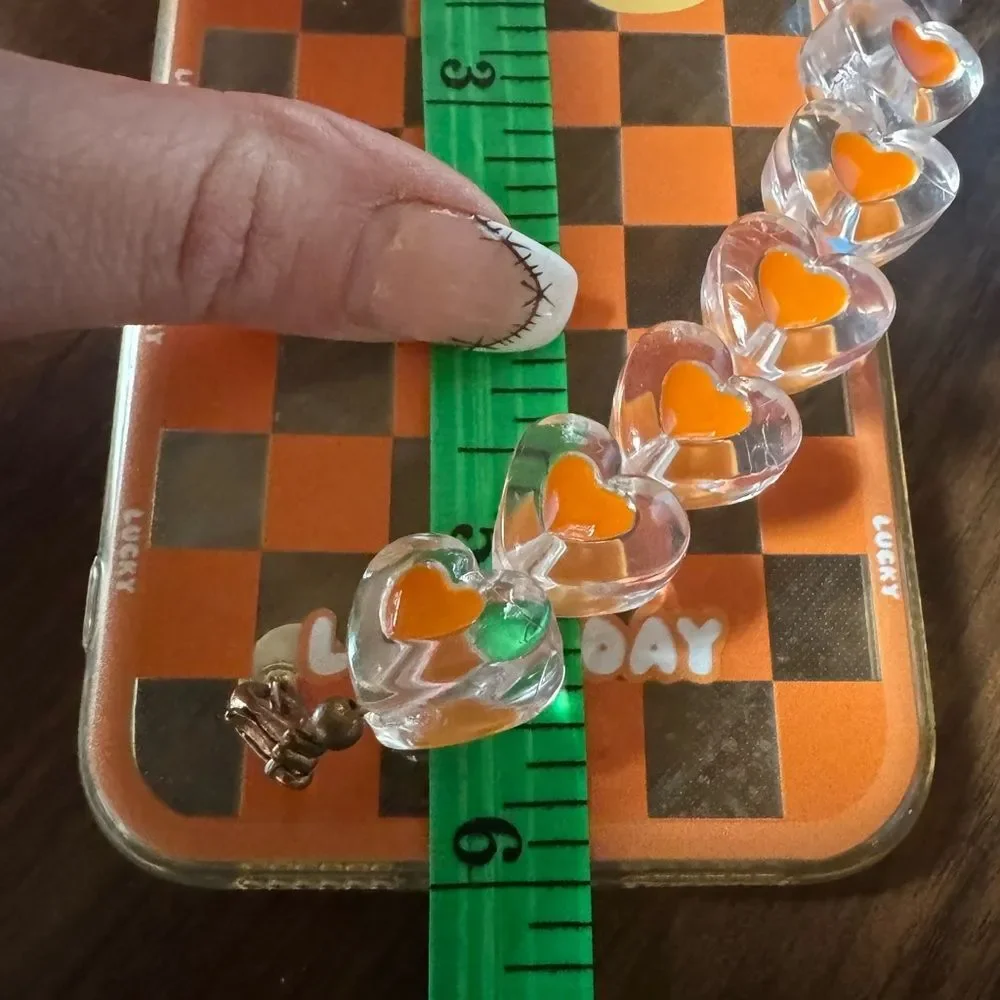 Orange Checkered Phone Case with Heart Charms